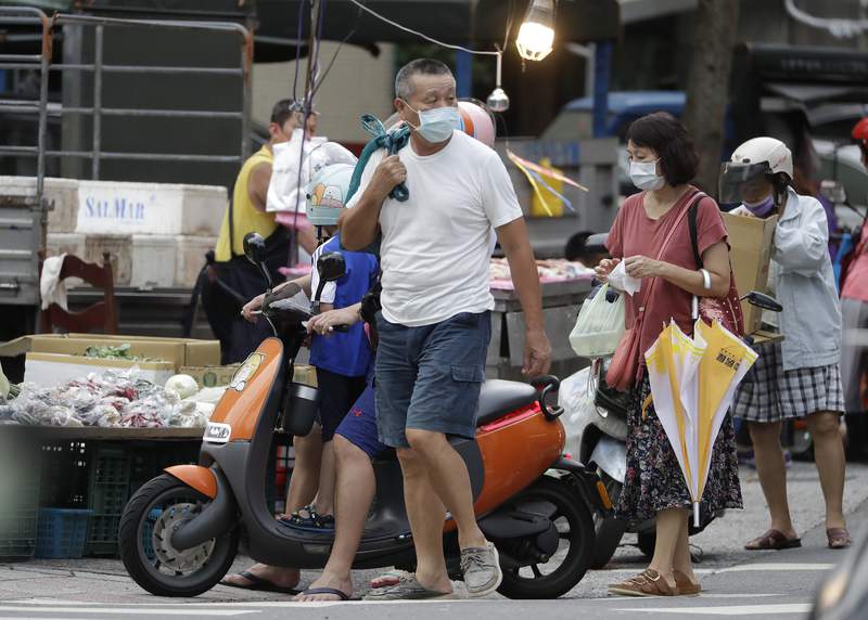 Taiwan's economy loses momentum as anti-virus controls pinch