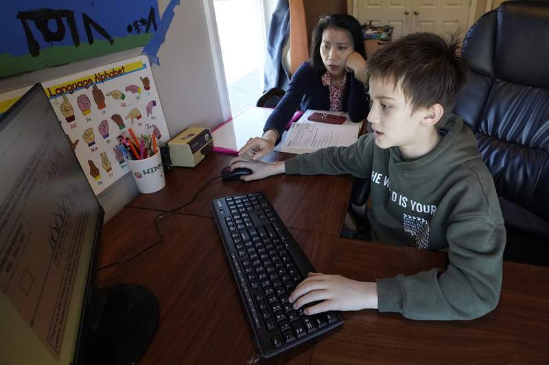 Asian Americans wary about school amid virus, violence