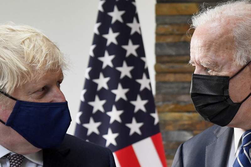 The Latest: Biden presents UK's Johnson with a US-made bike