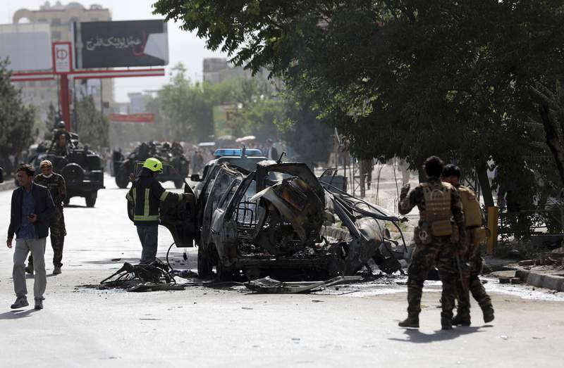 Afghan official: bombs hit 2 minivans in Kabul, 7 dead