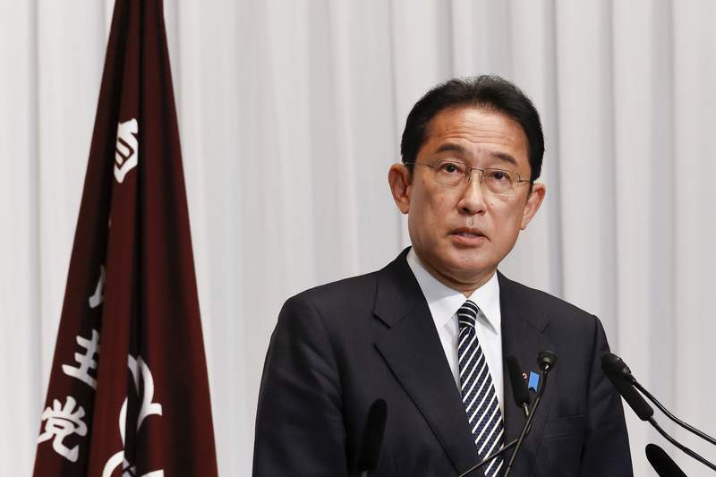 The Latest: Japan PM promises strong push for emission cuts