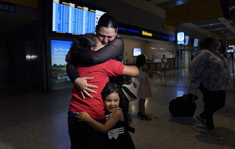 Tearful reunion after mom saw AP photo of daughter at border